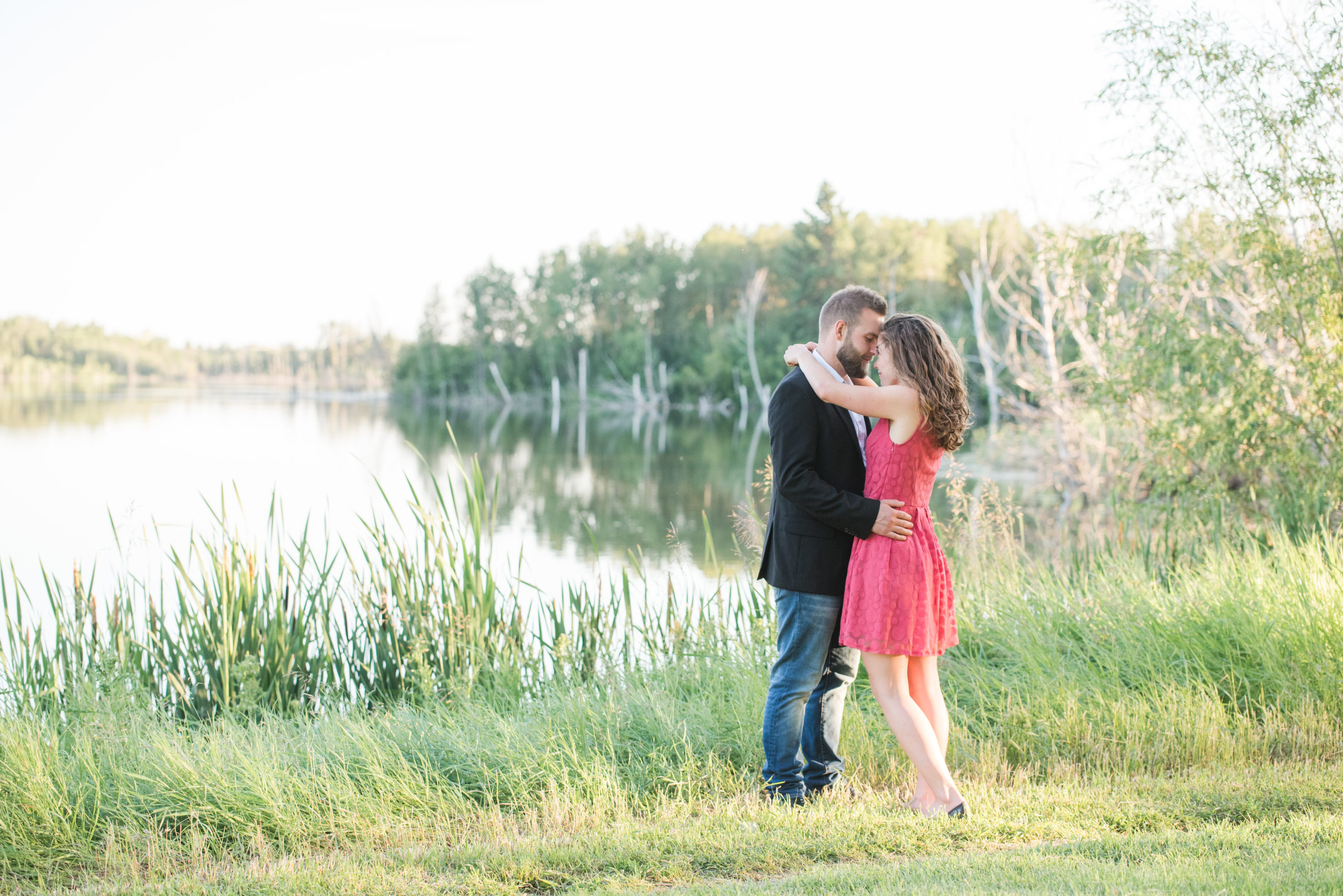 Couple walking around Elizabeth Lake for their engagement session.